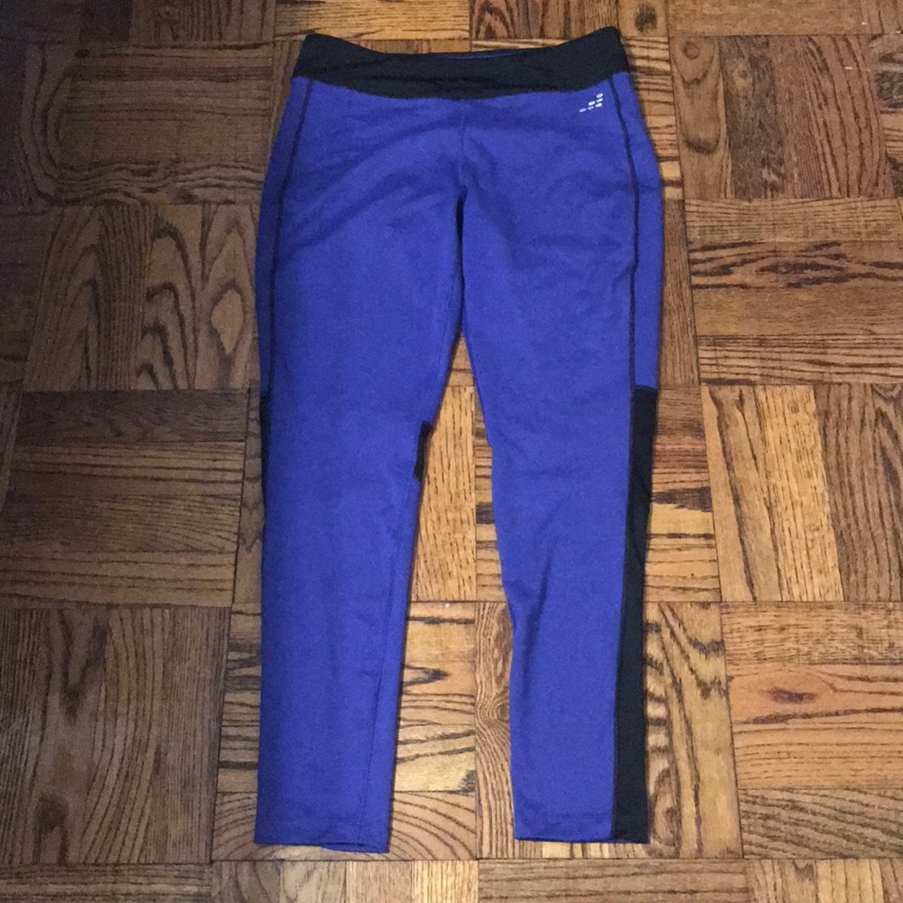 Dark blue/purple leggings with black mesh accents